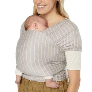 baby is wrap carrier against womans chest