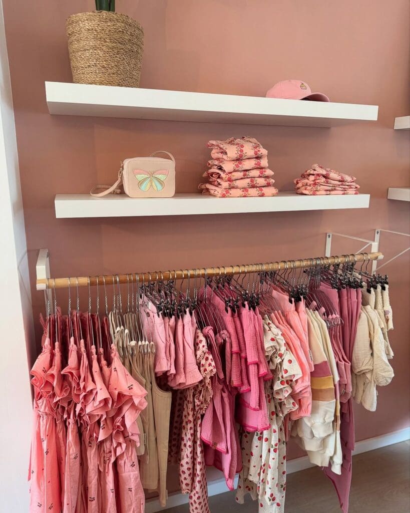 Pink clothing display rack at Munich children's boutique