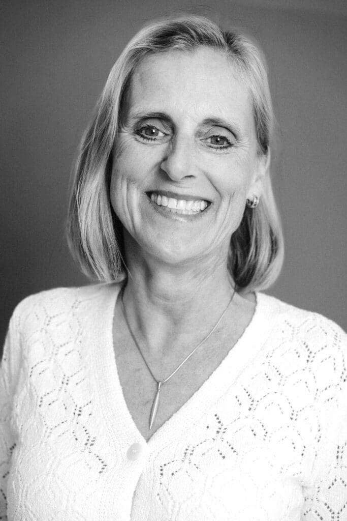 Black and white portrait of Lynn Darbyshire registered midwife and founder of Pippagina English prenatal classes Munich